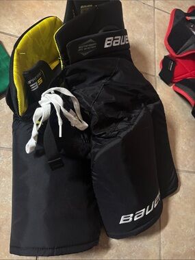 Bauer Men’s Black Hockey Shorts with Yellow Inner Liner
